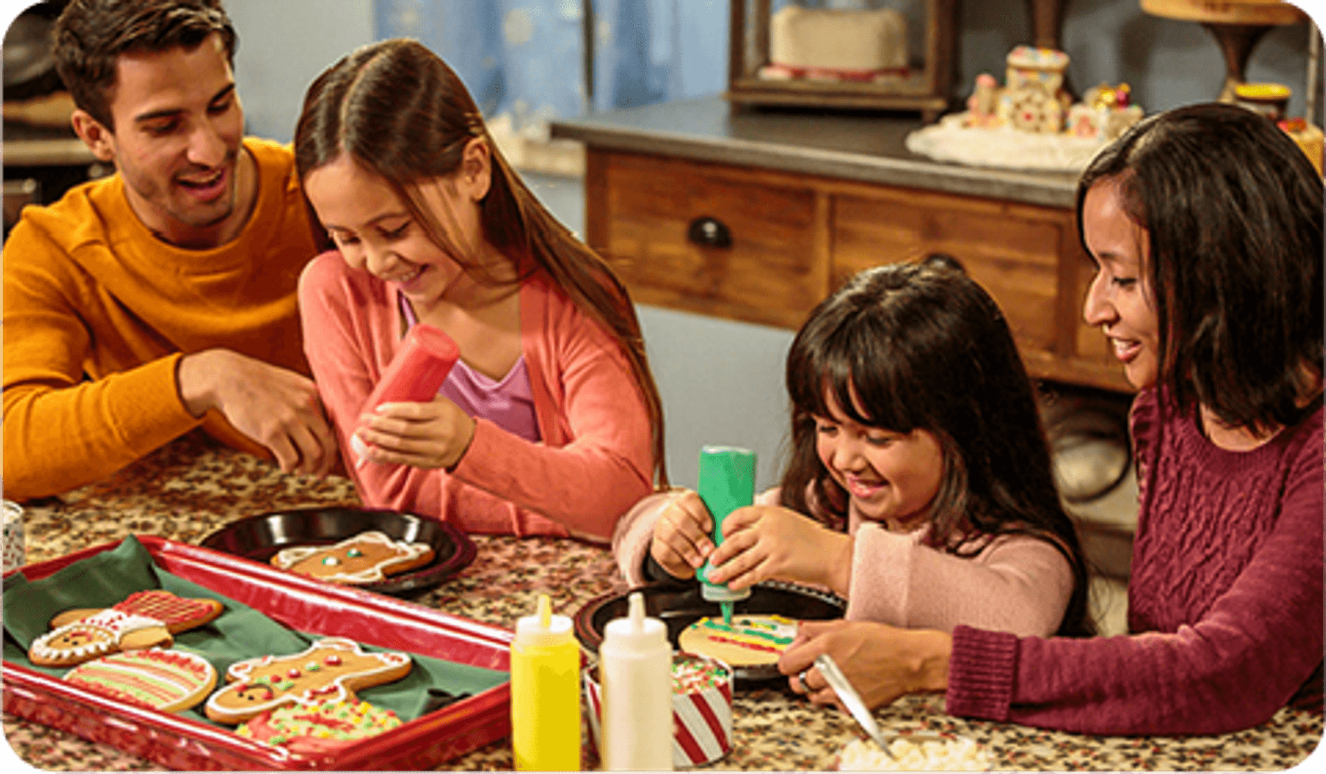 Family decorating holiday cookies